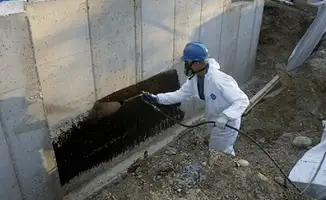 Professional waterproofing the exterior walls of the basement in Norfolk, VA