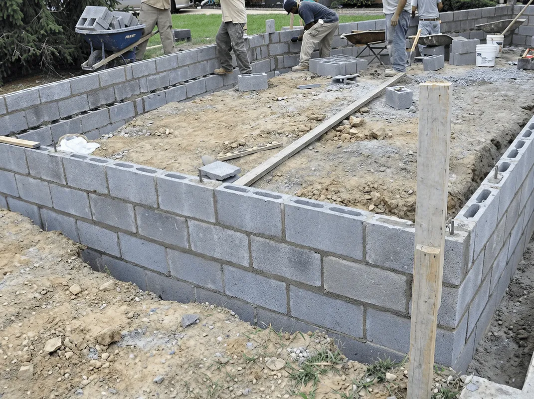 Professionals building a foundation with blocks in Norfolk, VA