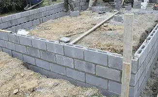 Professionals building a foundation with blocks in Norfolk, VA